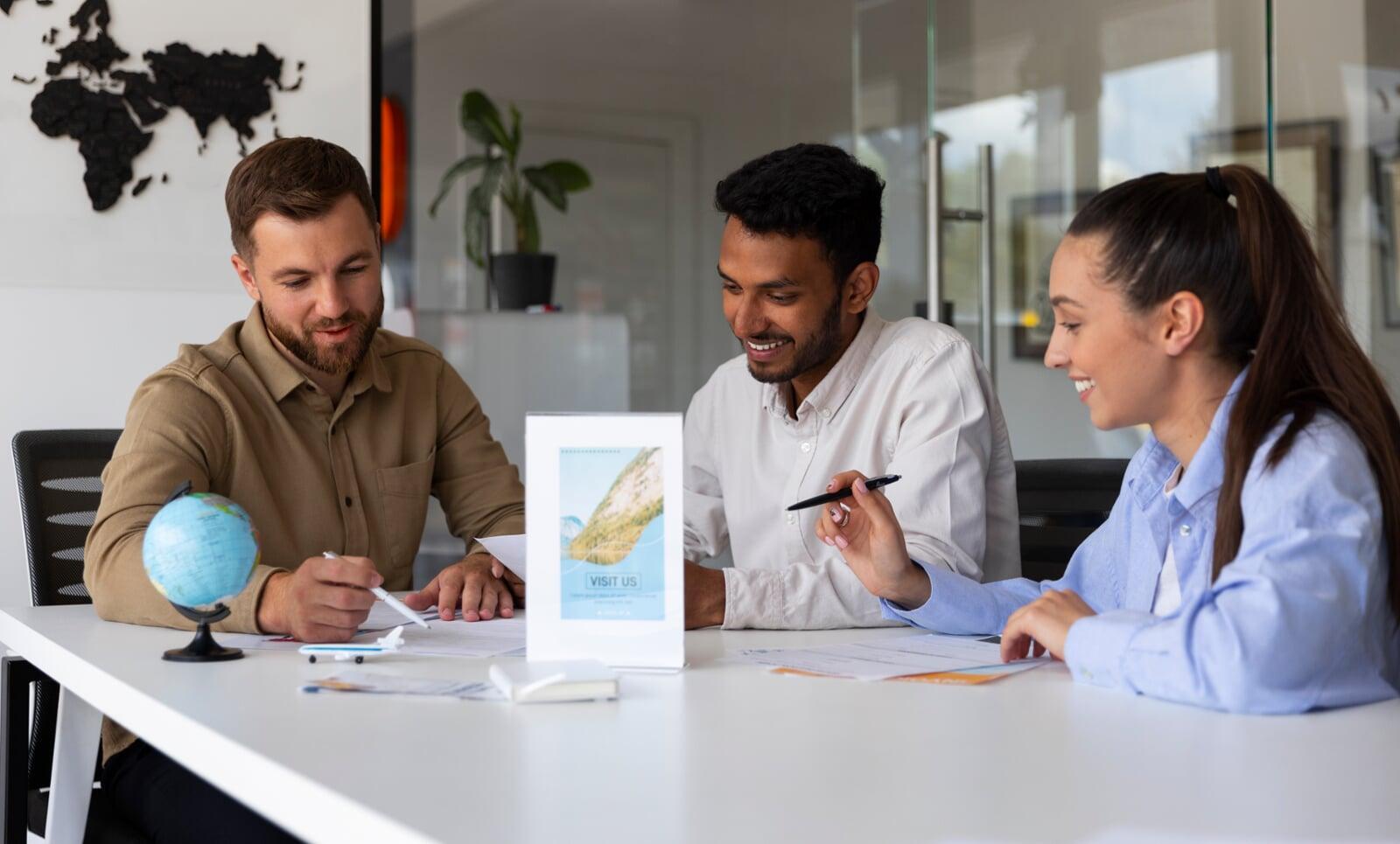 Diverse hands collaborating over a business document, symbolizing global connections